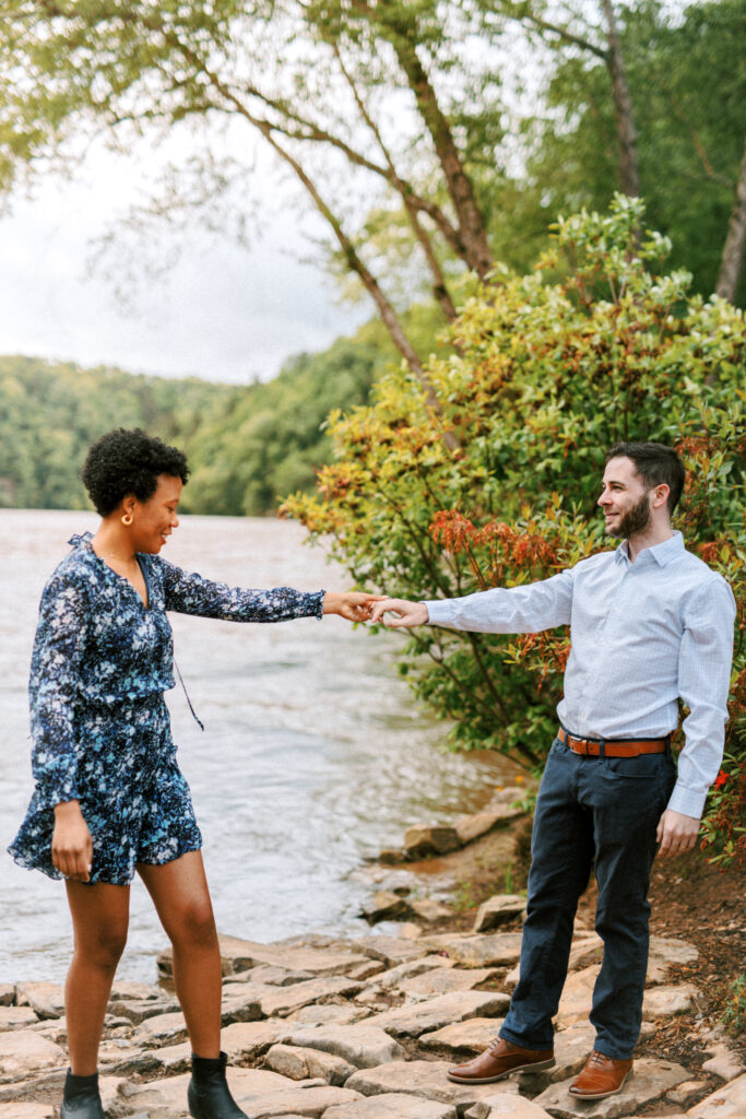 At Chattahoochee Coffee Company in Atlanta, Georgia, couple dances along the river