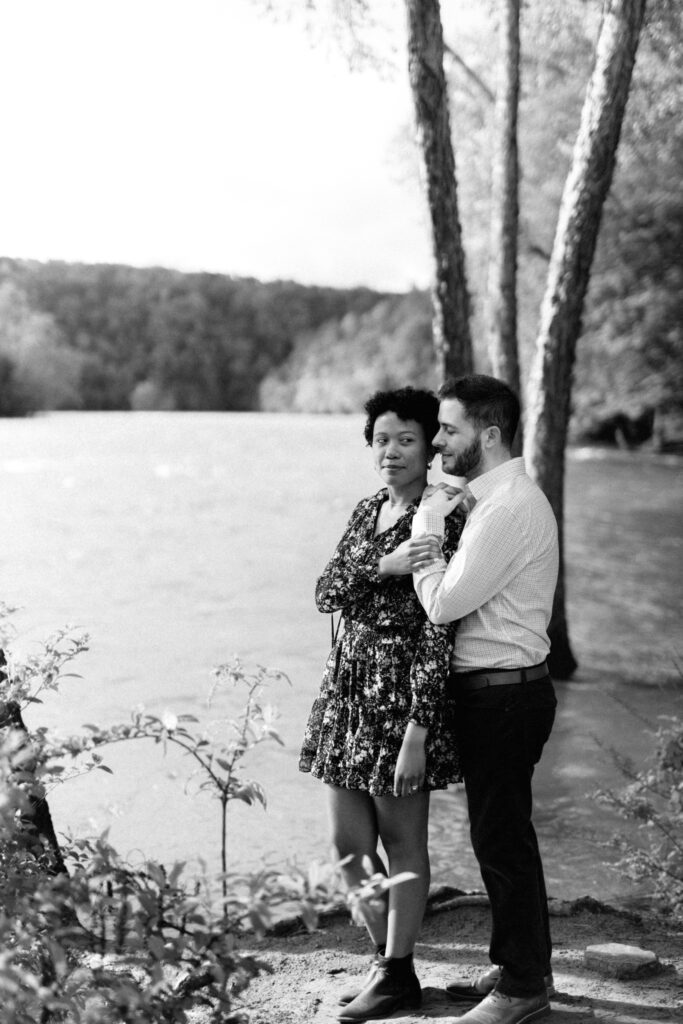 Black & white photo of couple during engagement photo session in Atlanta, GA at Chattahoochee Coffee Company