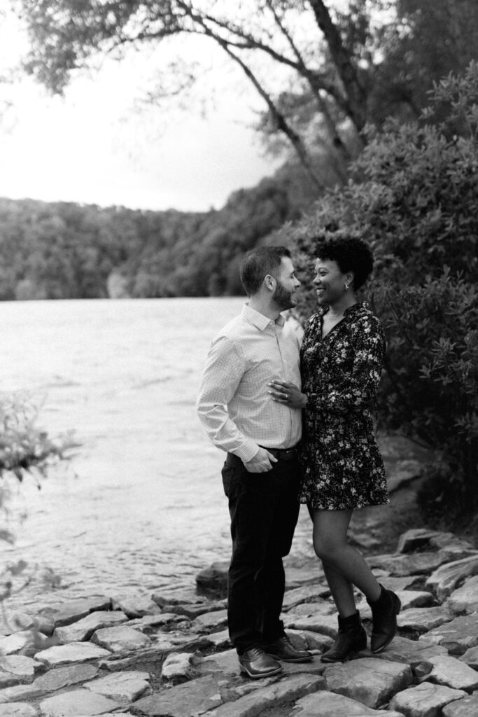 Couple looks at each other lovingly during a Chattahoochee Coffee Company engagement photography session