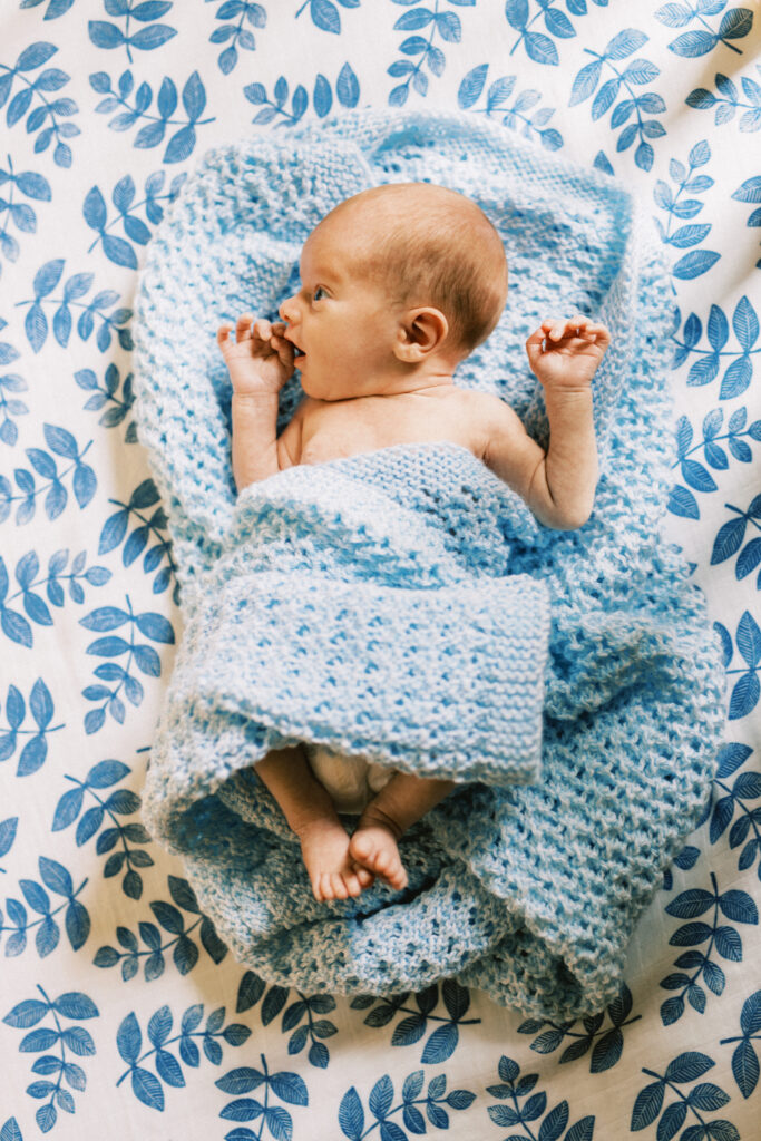 Newborn baby in crib