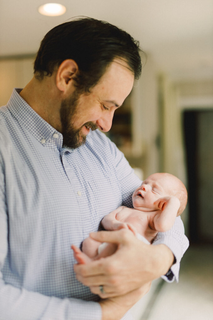 Father looking upon newborn baby in Marietta, Georgia