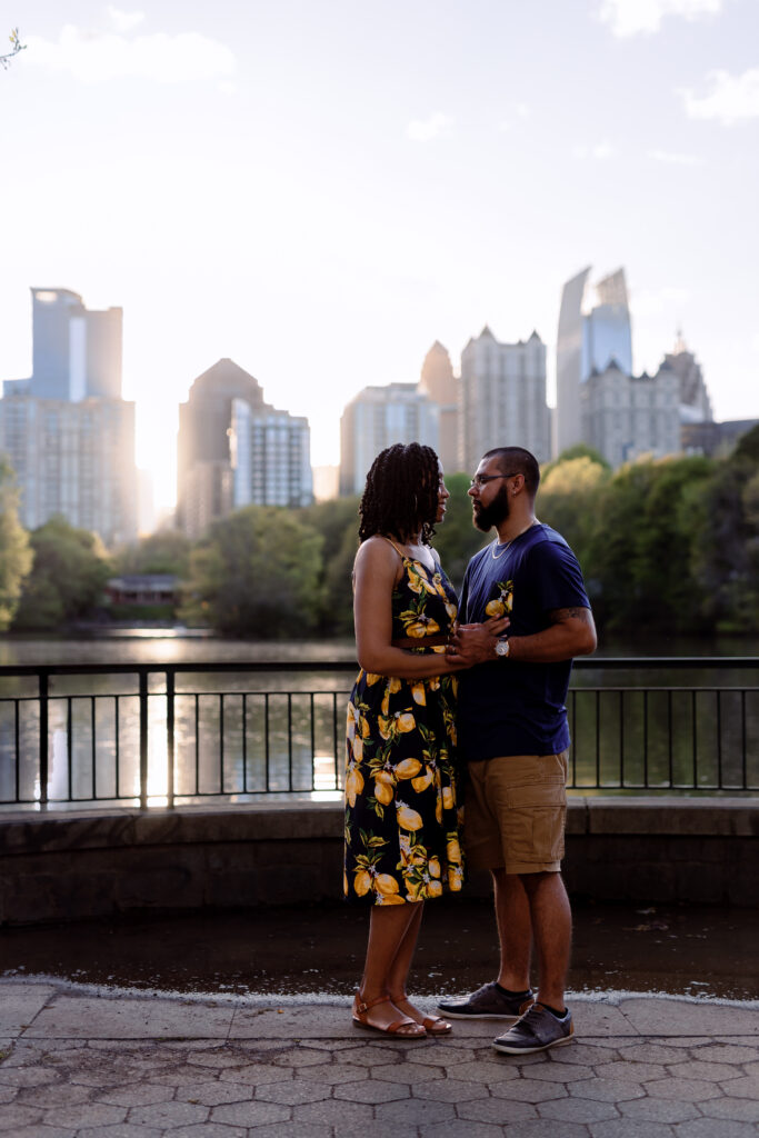 Couple dances at sunset in front of Atlanta Skyline at Piedmont Park