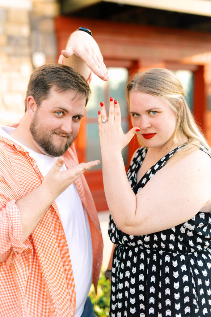 Couple poses silly after becoming engaged at Keegan's Irish Pub in Kennesaw, GA