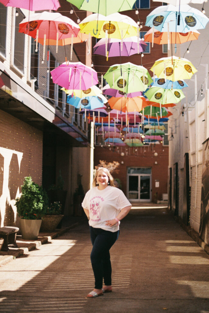 Bride poses under umbrellas in Chattanooga, TN wearing "parton me, I'm the bride" t-shirt